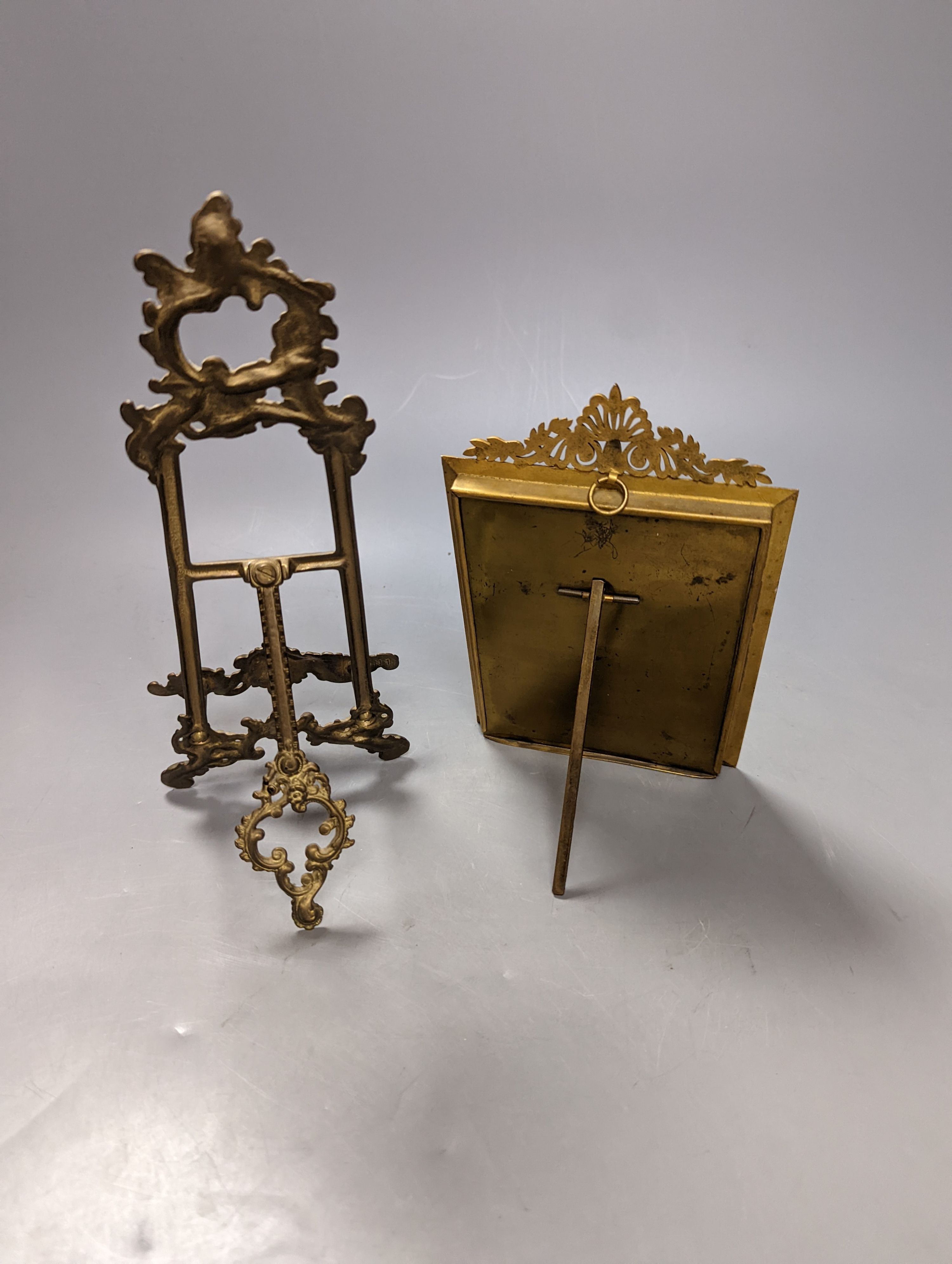 Victorian miniature print of a lady in a black feather hat in a gilt brass frame and a small brass easel, easel 25 cms high.